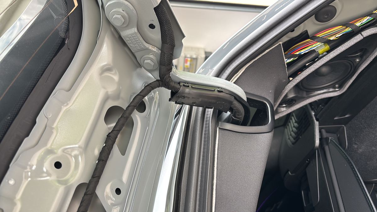 Dashcam installation with wiring hidden behind the headlining