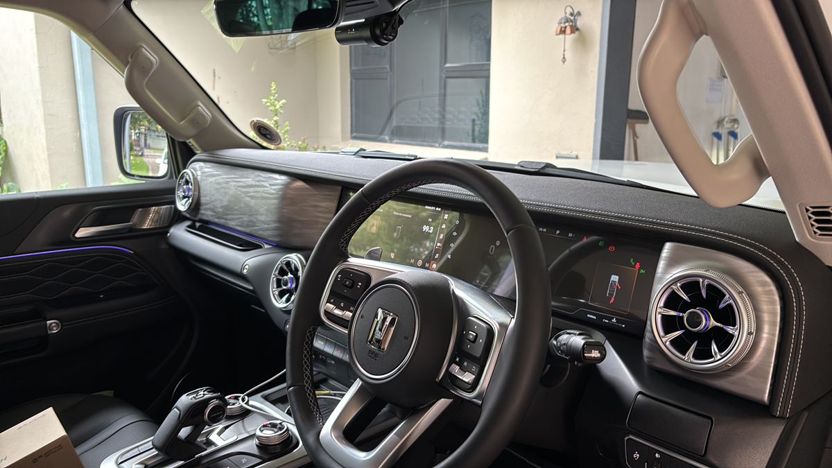 Compact front dashcam positioned for full road coverage